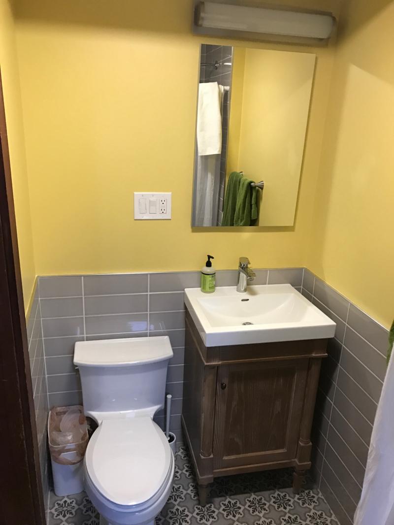 From a small walk-in closet to a functional bathroom, complete with shower!
